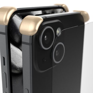 May include: A black smartphone with a gold protective case and a clear screen protector. The phone has a dual camera system on the back.