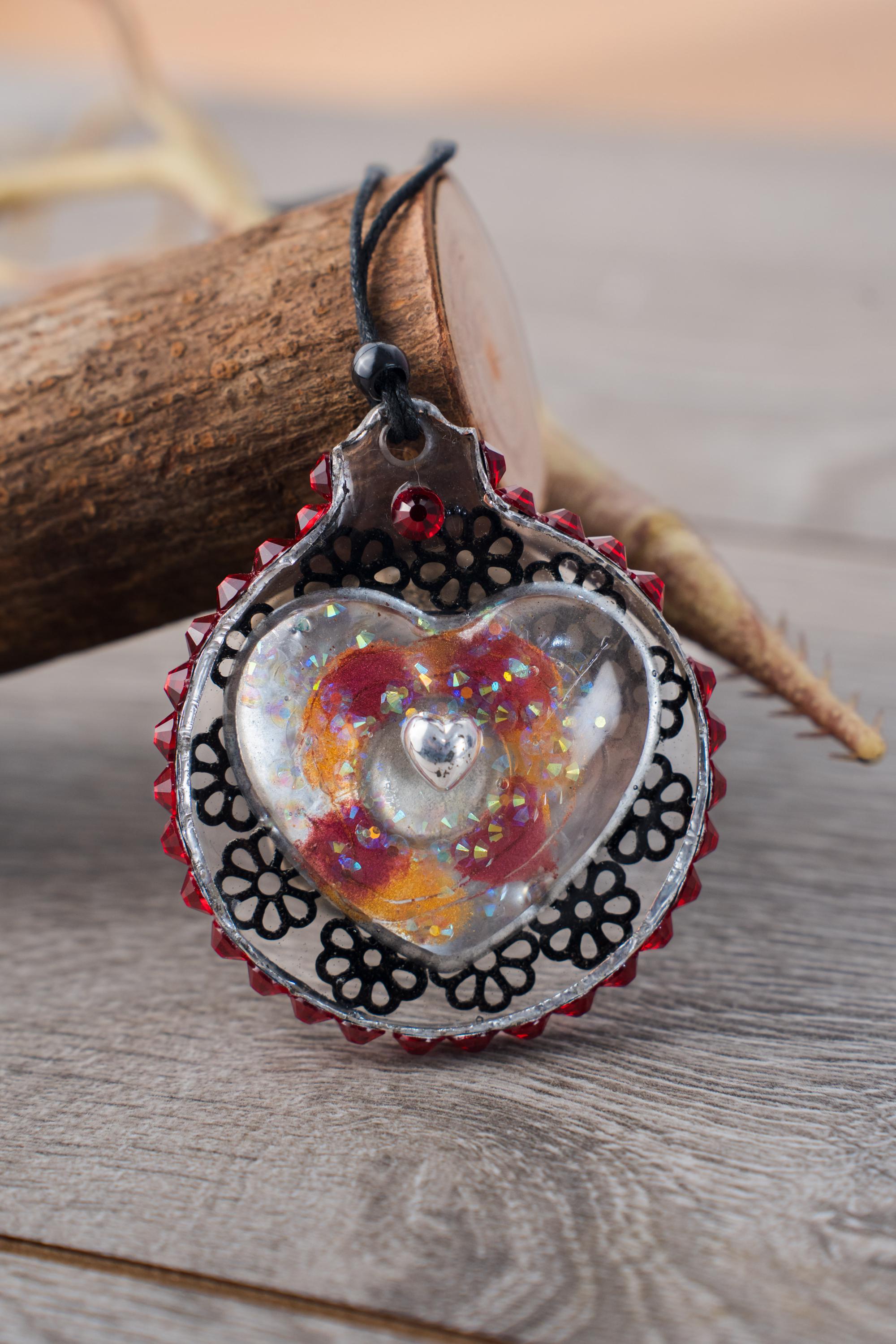 Bleeding Heart - Resin ornament with handmade heart cabachon nestled in a bed of black and silver shavings with a rhinestone halo - Image 1