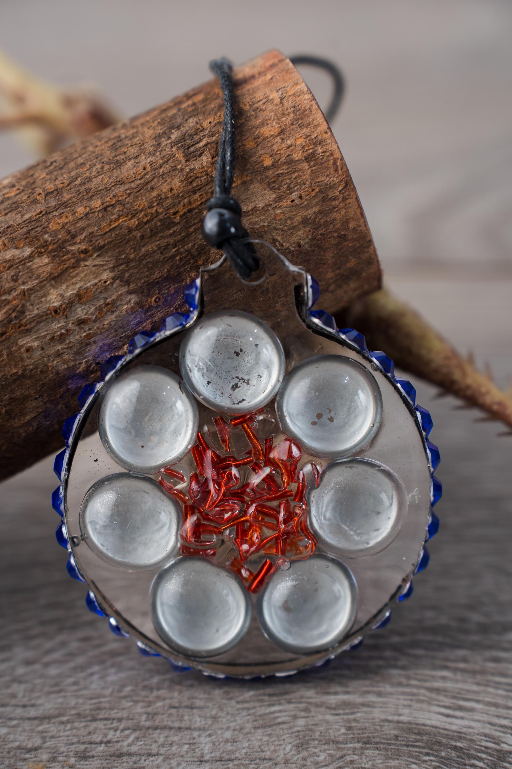 Seven Moons - Resin ornament with a design featuring silver backed pebbles, bugle beads and a rhinestone halo - Image 1