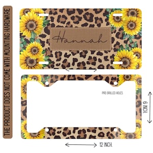 Op de afbeelding: Kentekenplaat met een luipaardprint achtergrond, zonnebloemen en de naam "Hannah" op een bruine patch. De plaat is 30,48 cm lang en 15,24 cm hoog. De tekst "PRE-DRILLED HOLES" is zichtbaar.