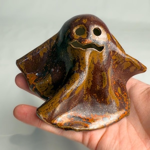 Handmade Ceramic Ghost Figurine: Rustic Halloween Decor, Glowing Sculpture