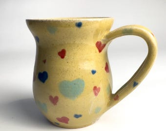 Handmade Ceramic Coffee Mug: Rustic Yellow Glazed Stoneware with Heart Pattern