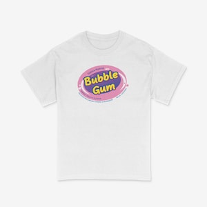 May include: White t-shirt with a pink and blue graphic of a bubble gum logo. The logo says "Bubble Gum" and "Indica Hybrid" with a sweet fruity flavor description.