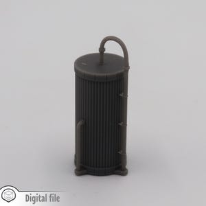 May include: A grey metal industrial tank with a pipe on top. The tank has a ribbed texture and is approximately 7.6 cm tall.
