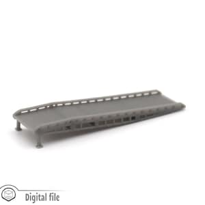 May include: A grey plastic model of a loading ramp with a textured surface and a series of small holes along the sides.