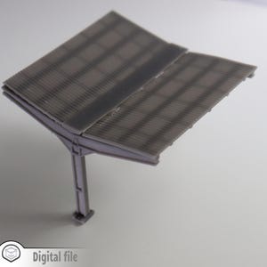 May include: A gray plastic model of a corrugated metal awning with a single support post. The awning is angled down and the support post is vertical.