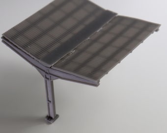 May include: A gray plastic model of a corrugated metal awning with a single support post. The awning is angled down and the support post is vertical.