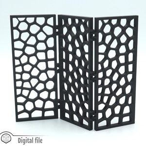 May include: A black three-panel room divider with a geometric pattern. The divider is made of a lightweight material and can be folded for easy storage.