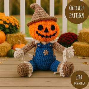 May include: A handmade crochet scarecrow doll with an orange pumpkin head, brown hat, and blue overalls. The doll has black eyes and a stitched smile. The image includes the text "CROCHET PATTERN" and "PDF DOWNLOAD".
