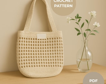 May include: Cream-colored crochet tote bag with a rectangular open weave design. The bag has a solid base and handles, with a small rectangular tag. The words "CROCHET PATTERN" and "PDF DOWNLOAD" are in the background.