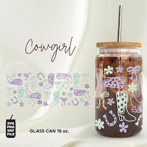 May include: A 16 ounce glass can with a wooden lid and a straw. The can is decorated with a pattern of purple and green cowboy boots, flowers, and horseshoes. The text "Cowgirl" is written in cursive at the top of the image.