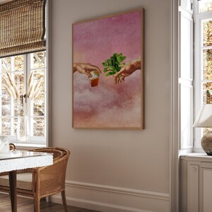 May include: A digital art print depicting two hands reaching towards each other, one holding a glass of tea and the other holding a sprig of mint. The background is a watercolour-style sky with clouds in shades of pink and orange.