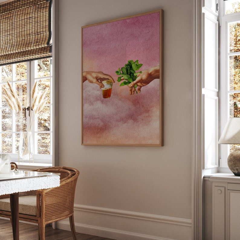 May include: A digital art print depicting two hands reaching towards each other, one holding a glass of tea and the other holding a sprig of mint. The background is a watercolour-style sky with clouds in shades of pink and orange.