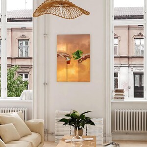 May include: A painting of two hands reaching towards each other, one holding a cup of liquid and the other holding a sprig of green leaves. The background is a golden sunset.