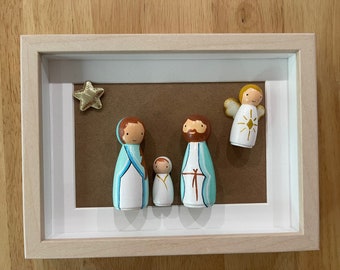 Framed hand painted wooden nativity scene