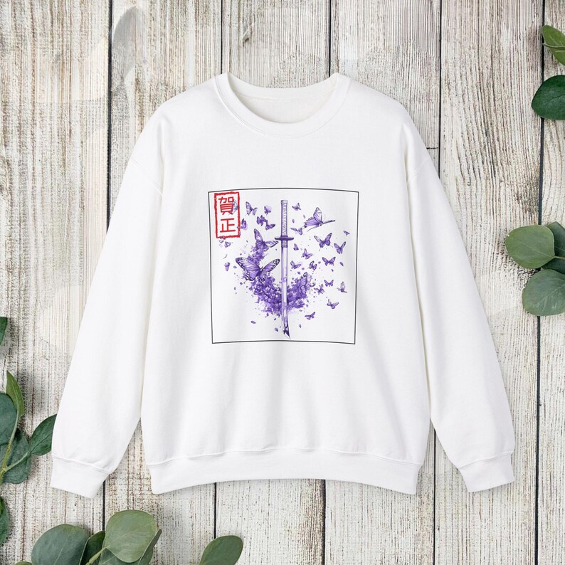 May include: White sweatshirt with a purple butterfly and sword graphic. The graphic includes the text "偖正" in a red square.