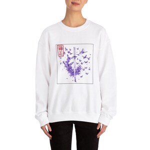 May include: White sweatshirt with a purple butterfly design and a red square with the text "真正" in Japanese characters.