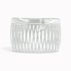 May include: A hair comb featuring a smooth, glossy white finish with a subtle pearlescent, marbled texture. The accessory has a solid, curved top edge and a series of fourteen evenly spaced, vertical teeth designed for securing hair in place.