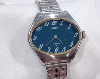 Vintage Damenuhr Seiko, Handaufzug, ovales dunkelblaues Zifferblatt, 2220-7090, Hi-Beat, 24 Steine
