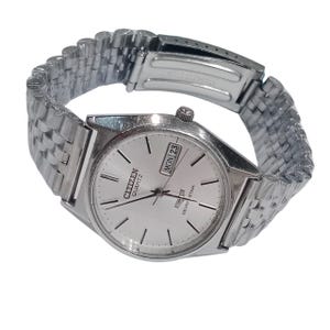 May include: A rustic wooden sign with the text "Welcome to our home" in white lettering. The sign features a distressed finish and a simple, inviting design, perfect for a front porch or entryway.