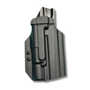 May include: A black molded holster featuring a contoured shape designed to fit a firearm. The holster has a textured matte finish, a raised sight channel at the top, and two black screws on the side panel to secure the molded plastic construction.