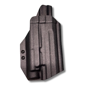 May include: A black molded holster with a textured matte finish, featuring a contoured shape designed to fit a firearm. The holster includes two visible black screws on the side, providing a secure assembly for the rigid, durable construction.