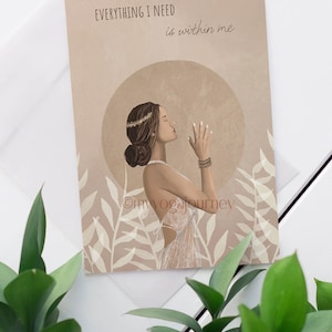 May include: Art print featuring a woman in profile with closed eyes, wearing a crown and bracelets, set against a beige background with the text "EVERYTHING I NEED is within me." The print has a boho aesthetic and includes botanical elements.