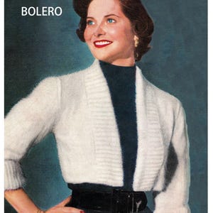 May include: Vintage image of a woman wearing a white tuxedo bolero sweater with a black belt and a dark blue top. The text "TUXEDO BOLERO" is at the top, and "BritKnits Vintage" is at the bottom.
