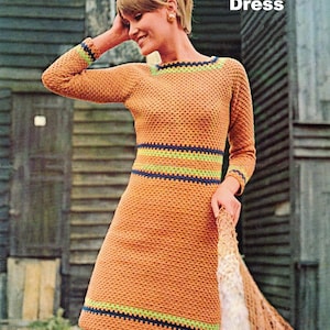 Può includere: Abito all'uncinetto arancione con maniche lunghe, caratterizzato da strisce verdi e blu navy sul collo, in vita e sui polsini. Il testo "Crochet Dress" è visibile in alto e "BritKnits Vintage" in basso.