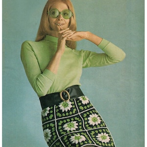 May include: A vintage image featuring a green turtleneck and a black and white crochet skirt with a floral pattern. The skirt is paired with a black belt with a gold buckle. The text "Crochet Skirt" and "BritKnits Vintage" are visible.