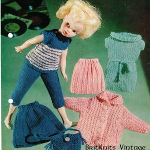 May include: A vintage knitting pattern for doll clothes. The pattern includes instructions for a striped top, pants, skirt, cardigan, dress, and a handbag. The pattern is printed on a white background with a green border.