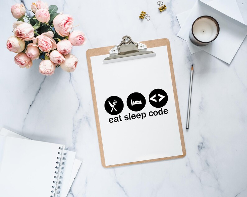 May include: A white clipboard with a brown frame and a silver clip. The clipboard has a white sheet of paper with black icons and the text "eat sleep code".