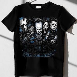 May include: A black short-sleeved t-shirt featuring a graphic print of five horror movie characters arranged in vertical panels. The design includes blue paint splatter accents and the text "BOYS OF FRIGHT" in a distressed, dark blue font.