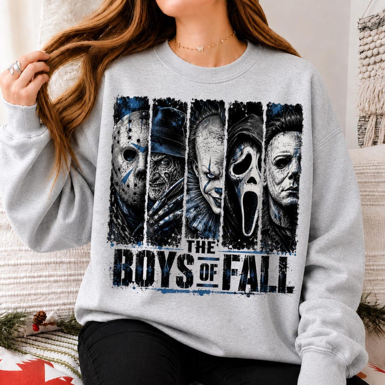 May include: A light grey crewneck sweatshirt featuring a graphic print of five horror movie characters arranged in vertical panels. Below the characters, the text reads THE BOYS OF FALL in bold, distressed black lettering with blue accents.