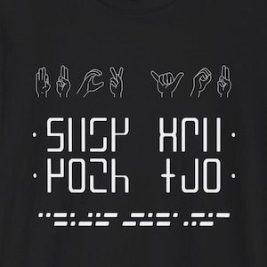 May include: Black t-shirt with white hand gestures and the text "SILLY XMI. POOH + JO."
