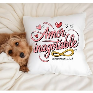 May include: White pillow with pink lettering that says "Amor Inagotable" with an infinity symbol and the text "Lamentaciones 3:22".