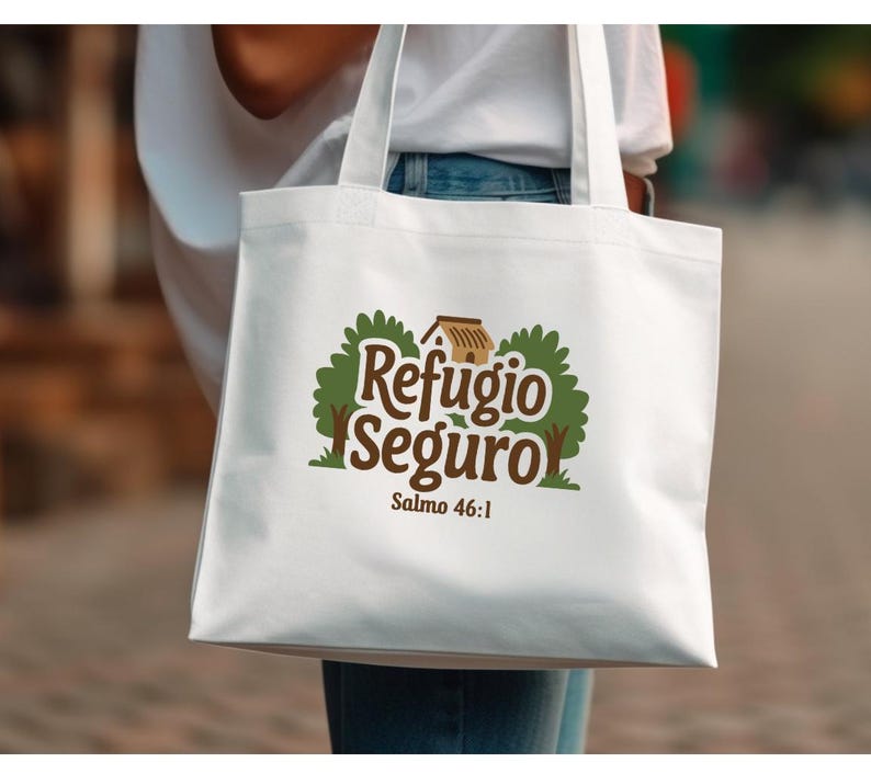 May include: White tote bag with a green and brown logo that says "Refugio Seguro" and "Salmo 46:1".