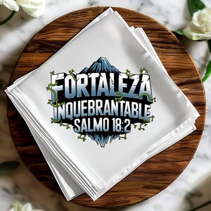 May include: A stack of white napkins with a blue and green graphic design featuring the text "FORTALEZA INQUEBRANTABLE SALMO 18:2".