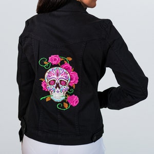 Black denim jacket for women with embroidered back.