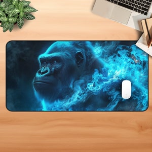 May include: A black gorilla with blue flames behind it. The gorilla is looking to the left. The background is dark blue with white stars.