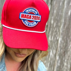 I’m Voting For The Felon MAGA Trump Red Trucker Hat. USA Trump red cap. Red white and blue patch conservative