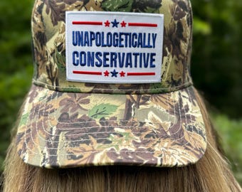 Unapologetically Conservative Camoflauge Trucker Hat. USA MAGA Trump 4th of July. Red white and blue patch