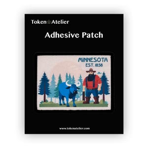 May include: Adhesive patch featuring a Minnesota design. The patch includes a blue bull, a lumberjack, and pine trees. The text "MINNESOTA EST. 1858" is also present. The patch is rectangular and set against a black background.