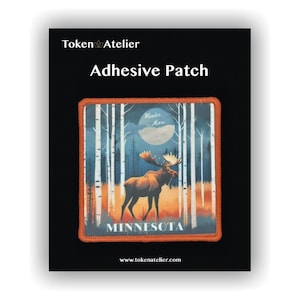 May include: Adhesive patch featuring a moose in a forest scene with a full moon. The patch has an orange border and the word "MINNESOTA" at the bottom. The text "Wander More" is above the moose. The brand name "Token Atelier" is at the top.
