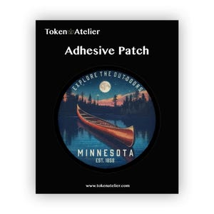 May include: A round, blue and red adhesive patch with a canoe on a lake at night. The text "Explore the Outdoors" is written around the top of the patch. The text "Minnesota Est. 1858" is written at the bottom of the patch.