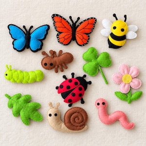 May include: A collection of felt appliques featuring a blue butterfly, an orange monarch butterfly, a yellow and black bee, a brown ant, a green clover, a green caterpillar, a red ladybug with black spots, a pink flower, a green leaf, a snail, and a pink worm.
