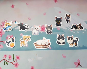 May include: A set of 10 colourful cat stickers featuring various poses and expressions. The stickers are printed on white paper and have a glossy finish.