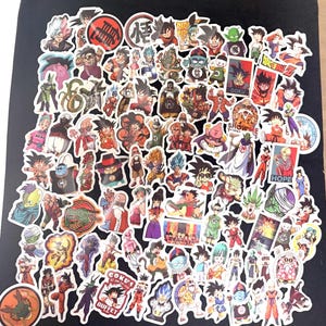 May include: A collection of colorful anime character stickers, featuring various characters in action poses. The stickers showcase a variety of designs, including characters with spiky hair and dynamic expressions. The stickers are on a black background.