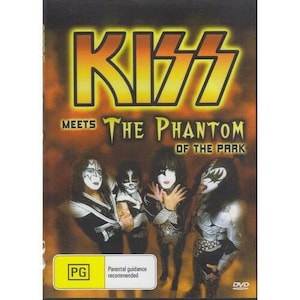 May include: A DVD cover featuring the band KISS with the text "KISS Meets The Phantom Of The Park". The cover features a black and white image of the band members in their signature makeup.