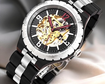 May include: An automatic watch with a black face, silver bezel, and a black and silver band. The watch face has gold-colored gears and red hands. The text "Automatic Watch" is at the top.